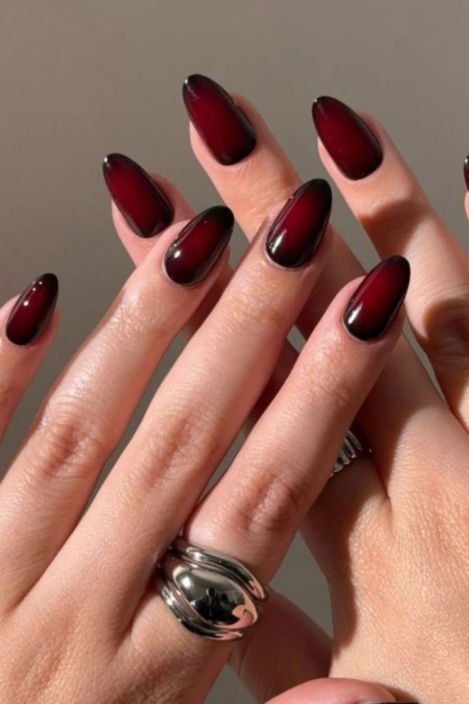 Smoky midnight burgundy aura nails
