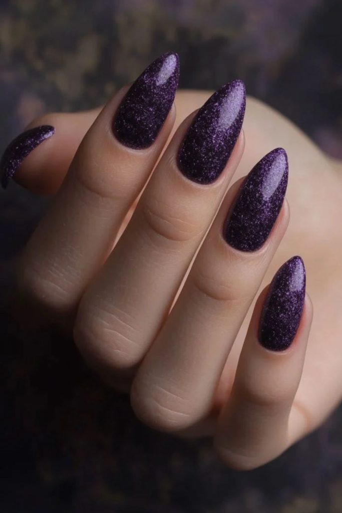 Dark glossy sugar plum nails.