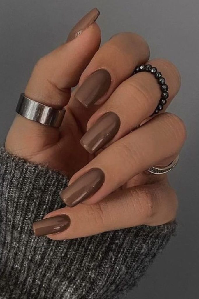 Minimal mocha nails with glossy finish.