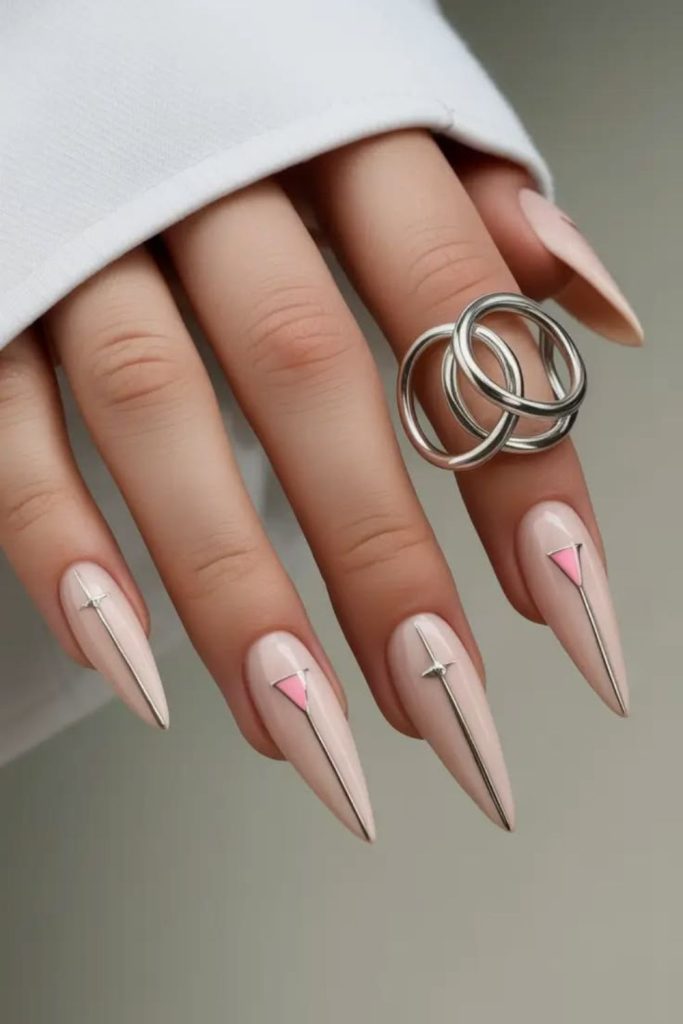 Minimal nude line stiletto nails.
