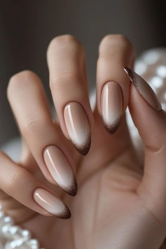 Romantic mocha French nails with hearts.