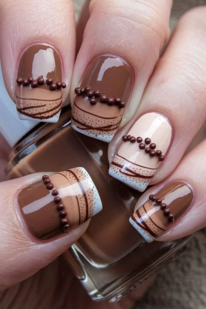 Mocha nails with fluffy marshmallow designs.