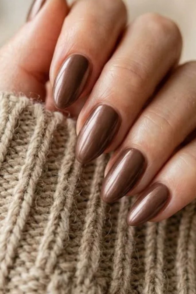 Pearly mocha nails with luminous finish.