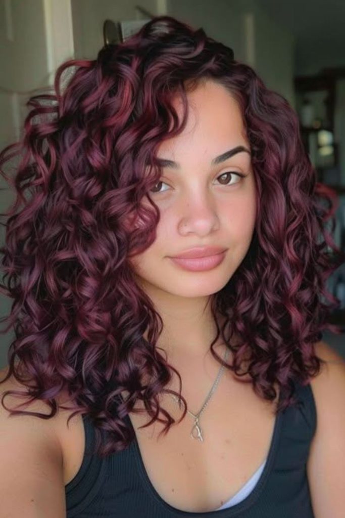 Mulled plum curls with warm undertones.