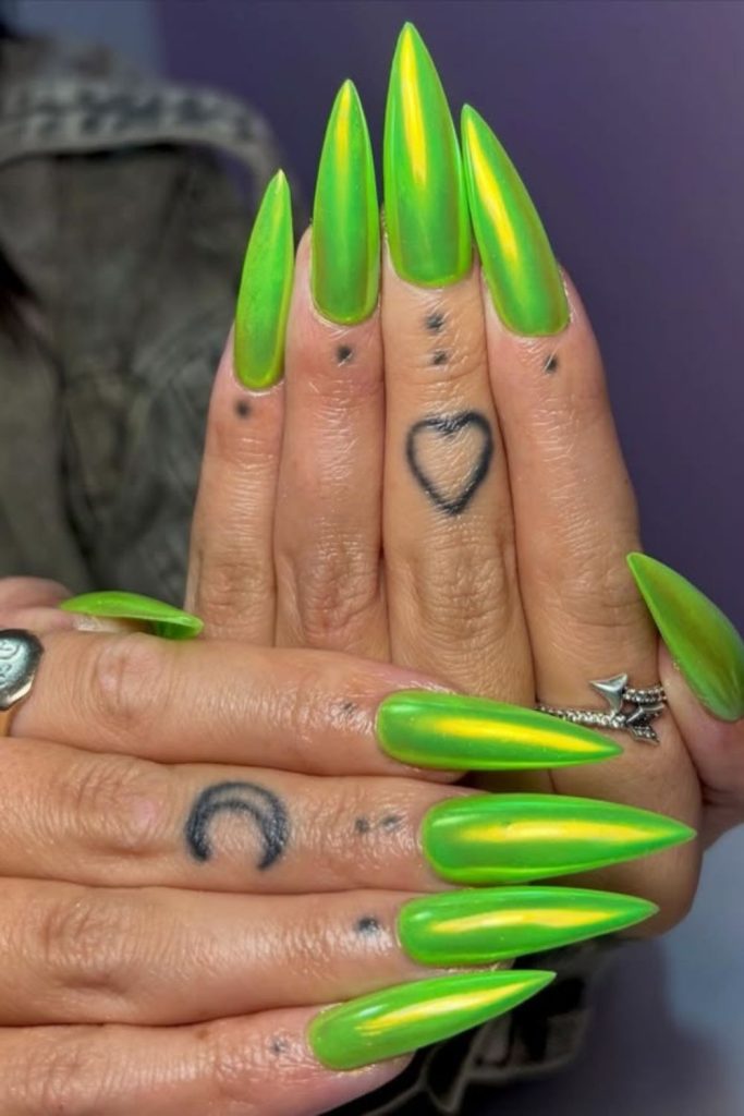 Neon green edgy stiletto nails.