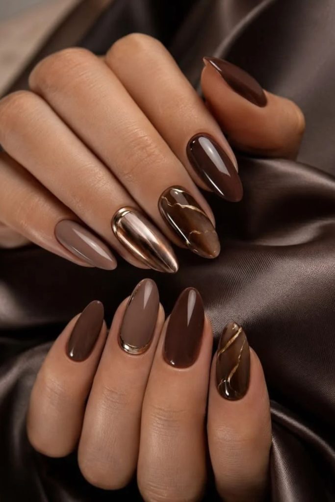 Hazelnut chocolate nails with caramel swirls.