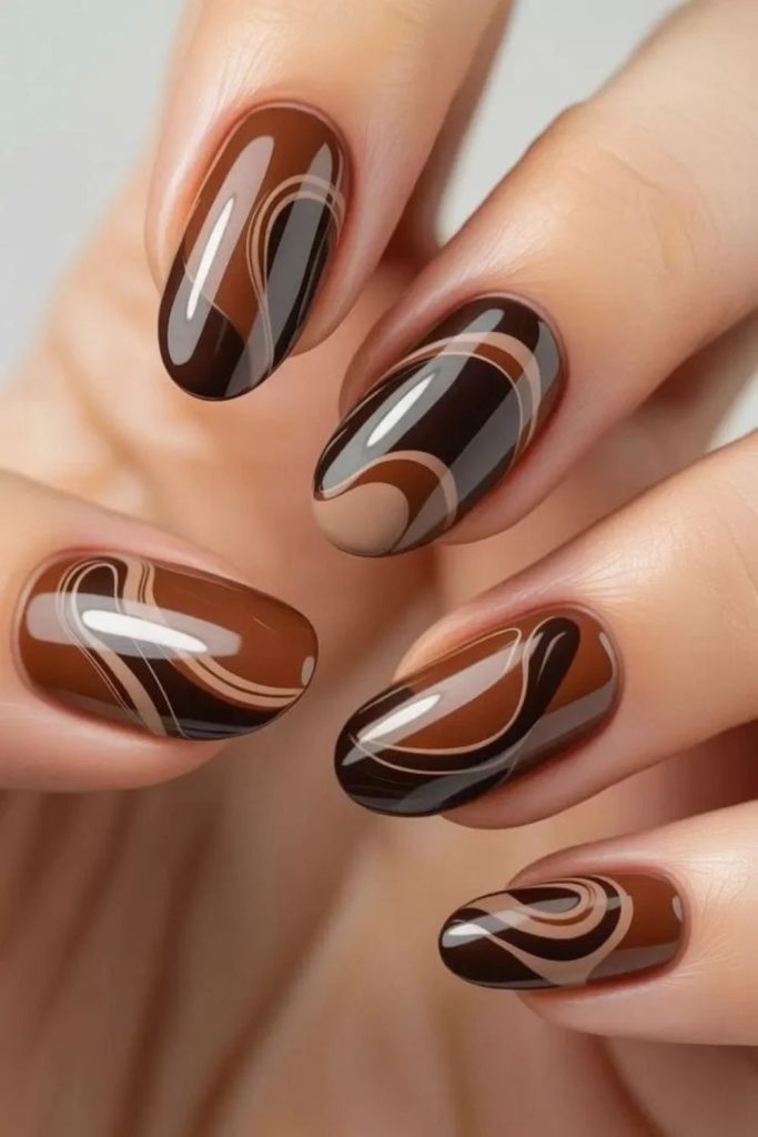 Chocolate nails with peppermint swirl accents.