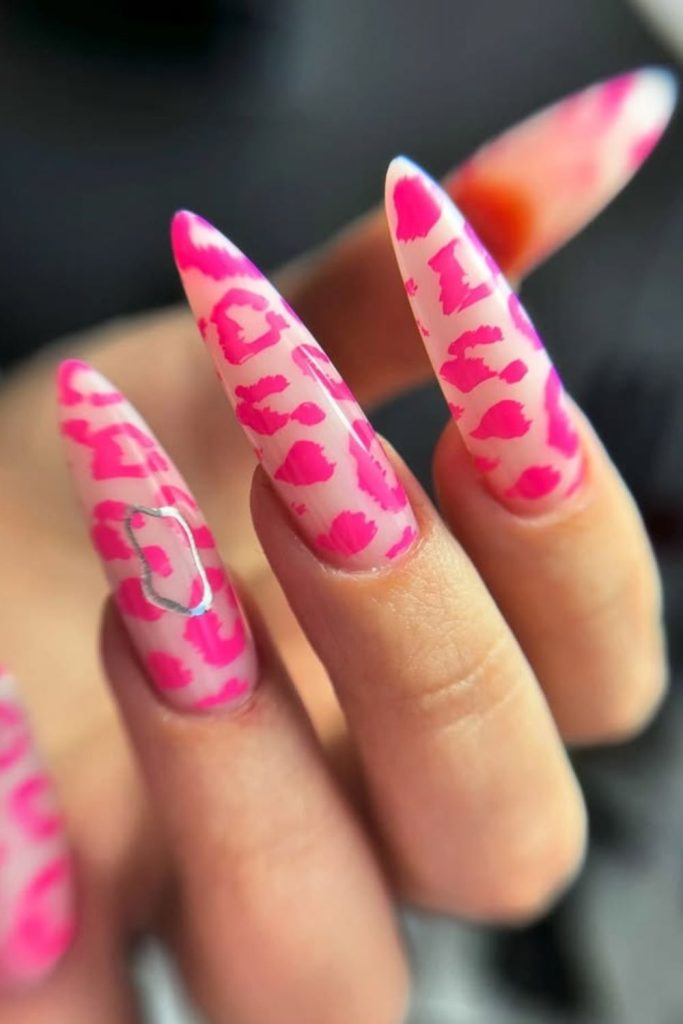 Hot pink leopard stiletto nails.