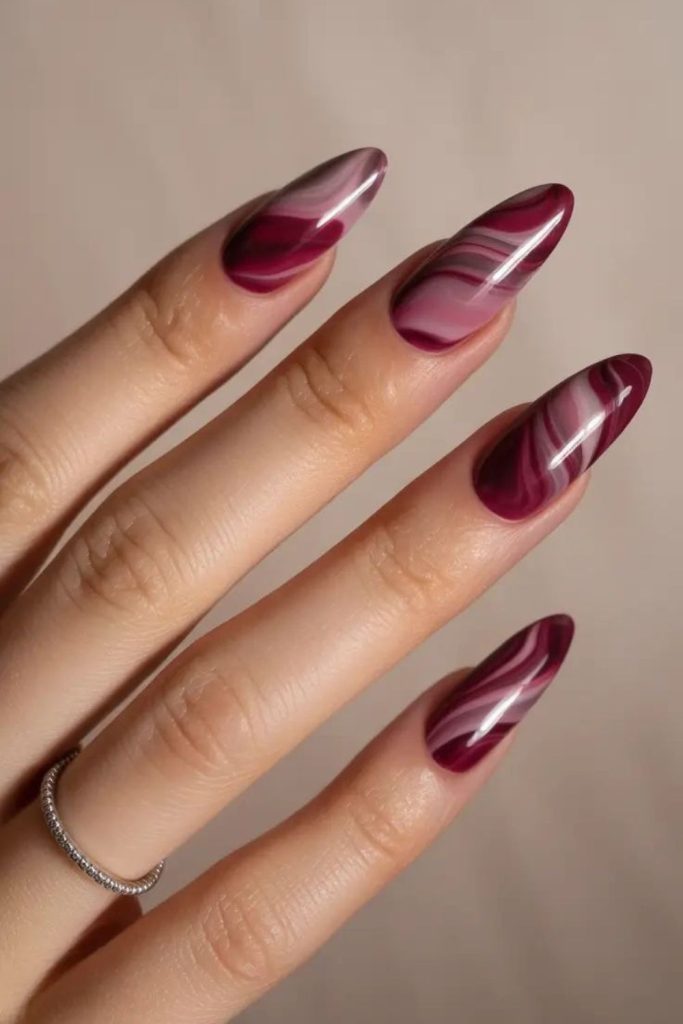 Playful sugar plum swirl nails.