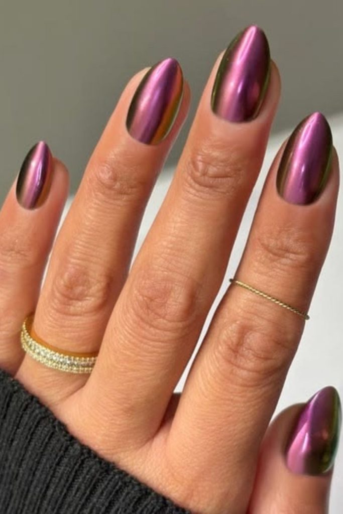 Shimmering plum chrome aura nails.