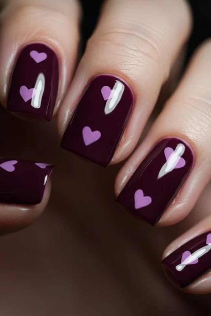Romantic sugar plum heart nails.