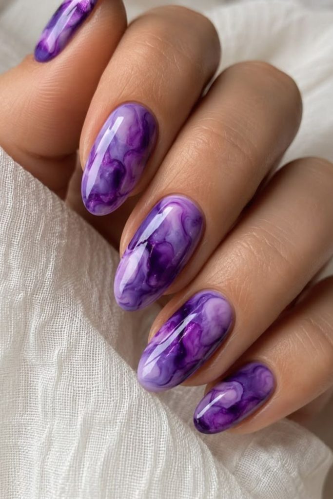 Marbled sugar plum nail design.