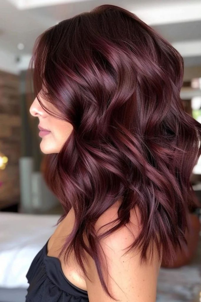 Plum mocha brunette hair with highlights.