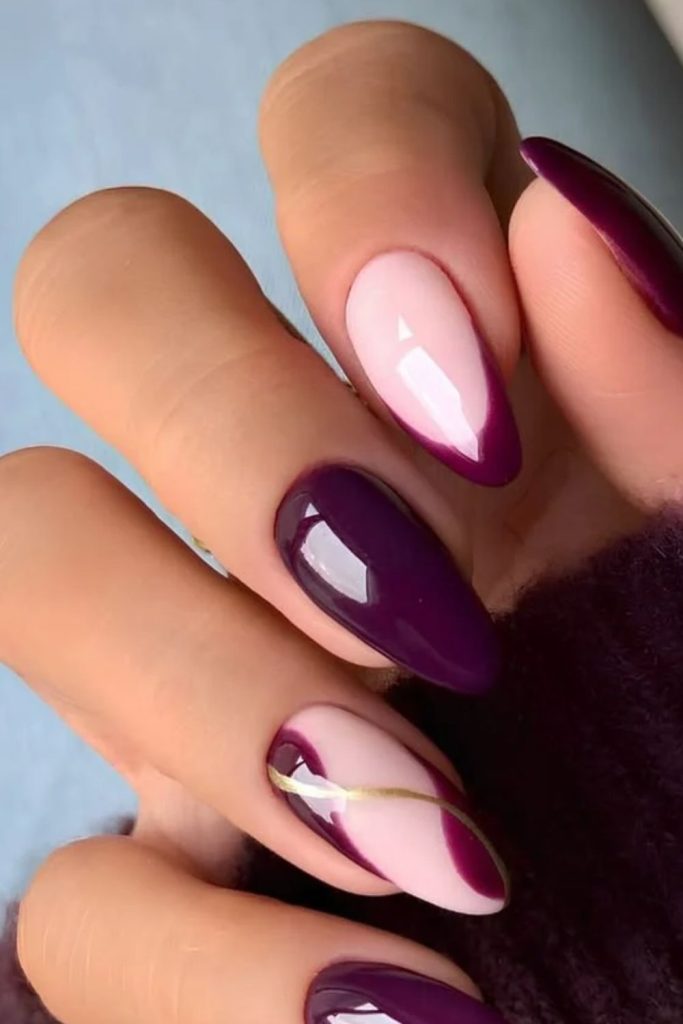Modern plum negative space nails.