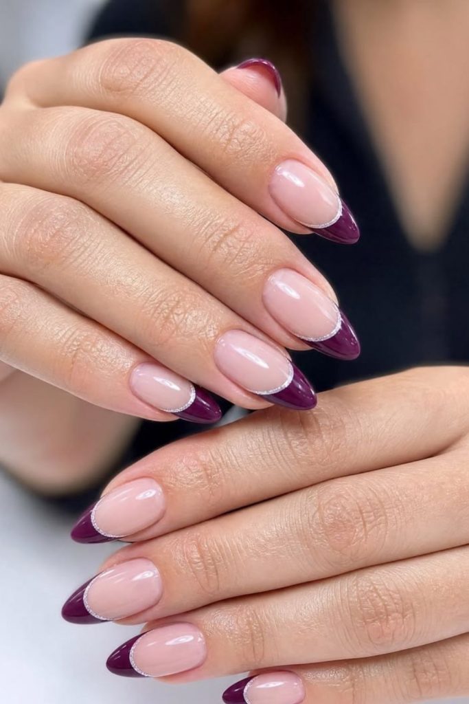 Elegant plum French tip nails.