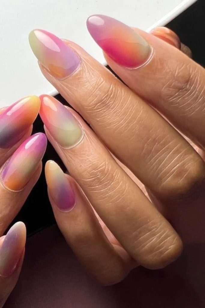 Colorful rainbow layered jelly nails.