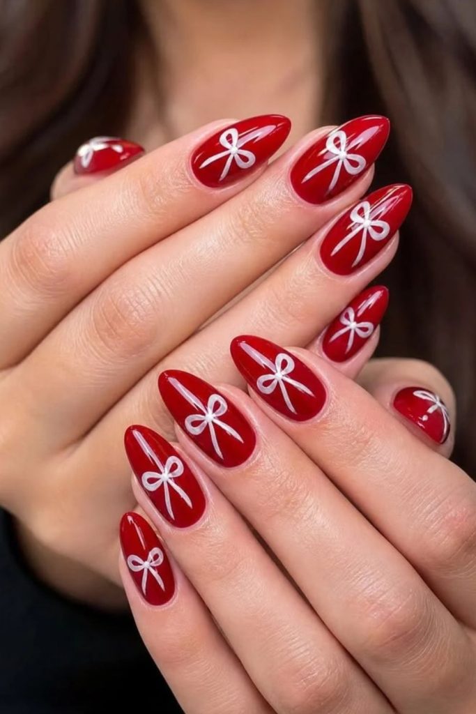 Red ribbon inspired candy cane nails.