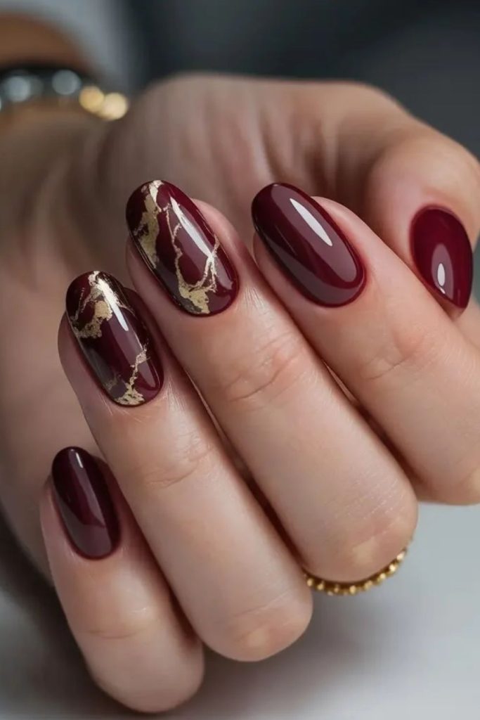 Royal burgundy nails with gold