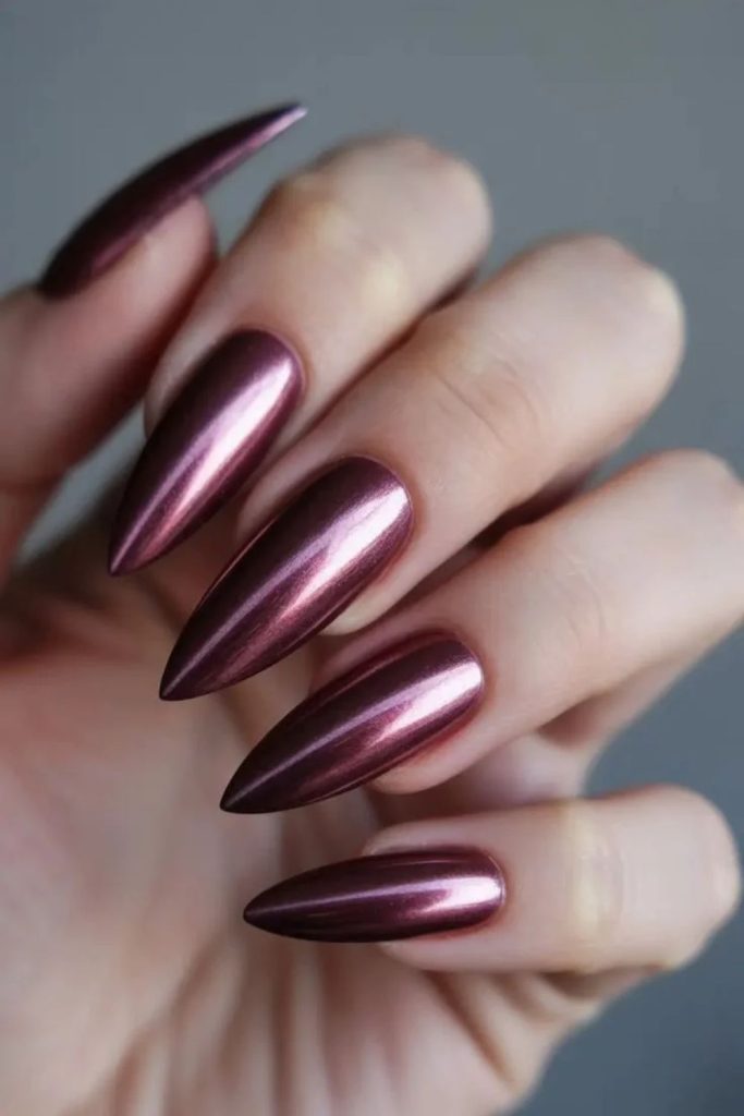 Metallic royal plum chrome nails.