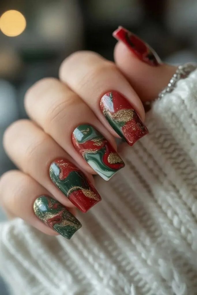 Ruby emerald swirling festive nail design.
