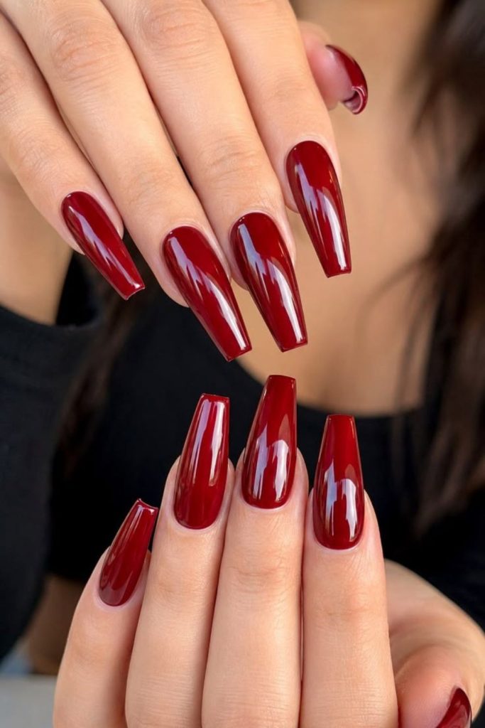 Scarlet red long coffin nails.