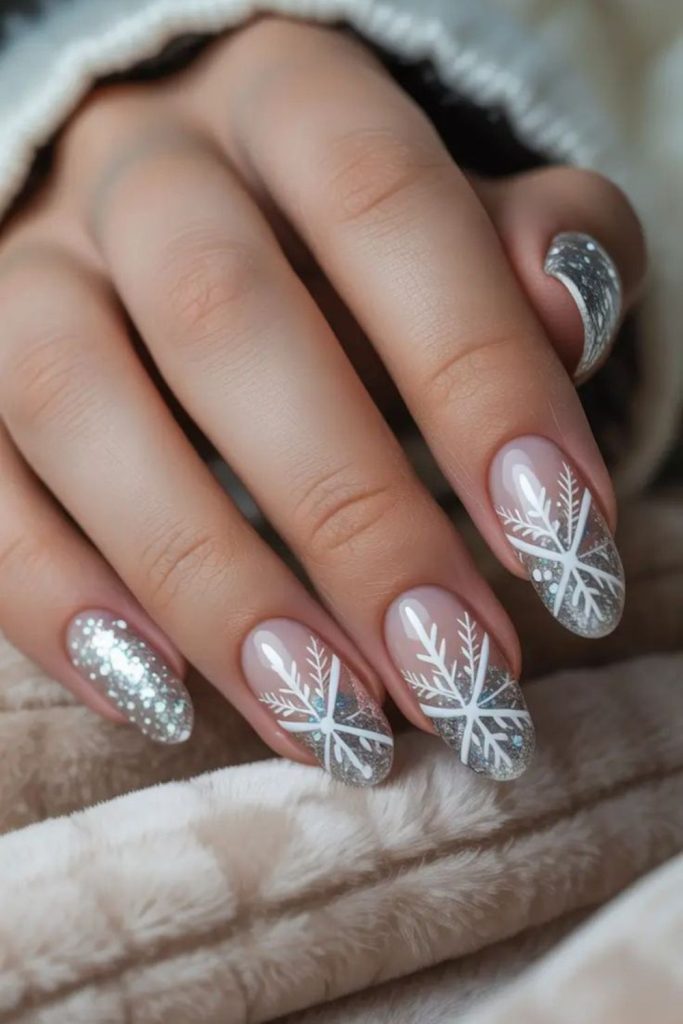 Sparkling silver snowflake winter nails.
