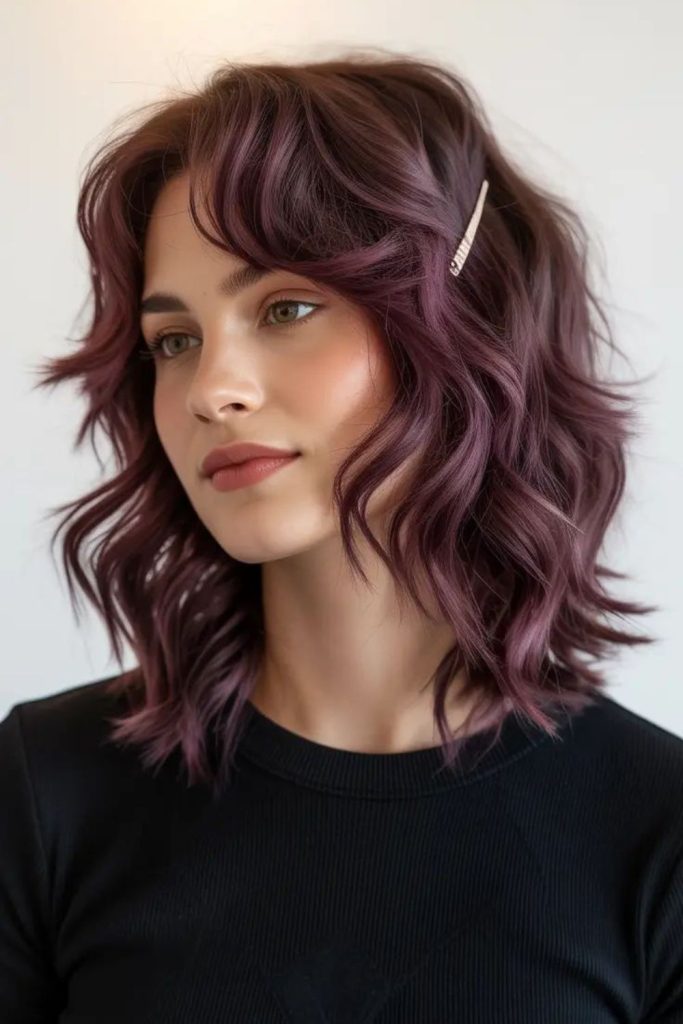 Smoked plum sleek charcoal toned hair.