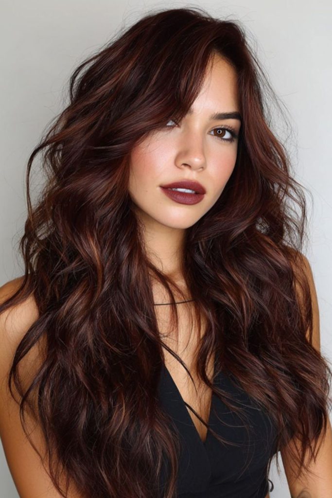 Smoky mahogany hair with dark undertones.