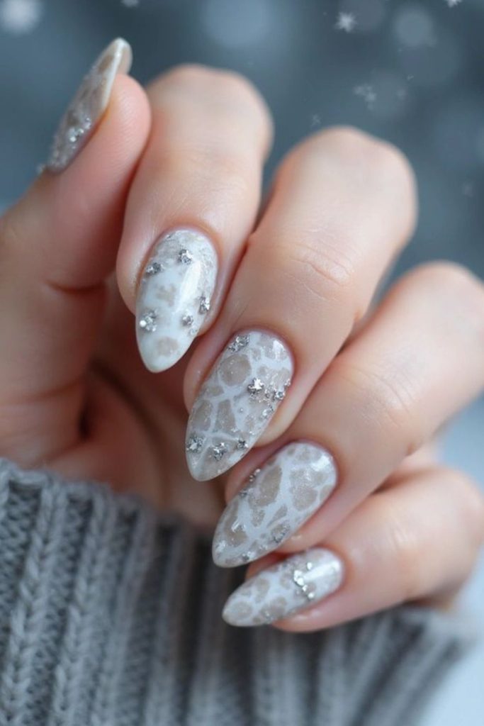 Silver white marble snowflake nails.