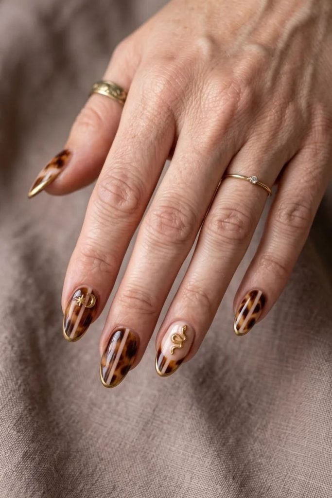 Soft caramel tortoiseshell elegant manicure.
