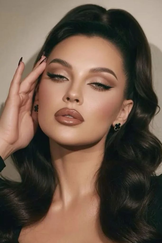 Soft taupe subtle siren eye makeup.
