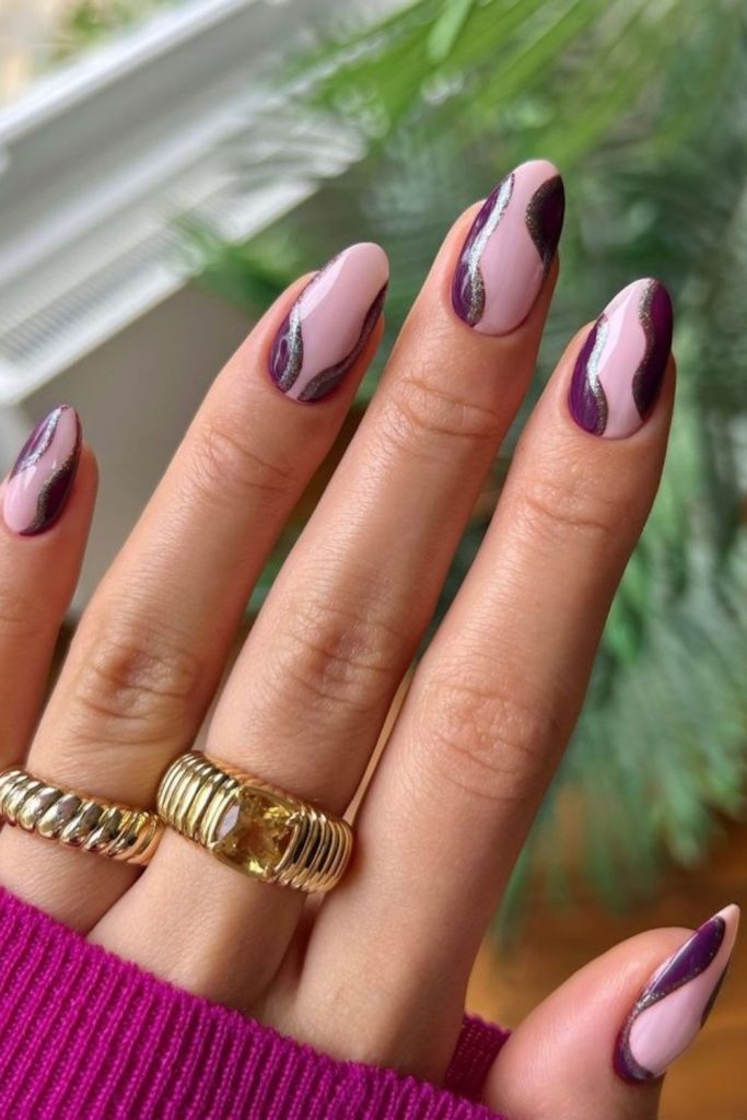 Swirled sugar plum French nails.