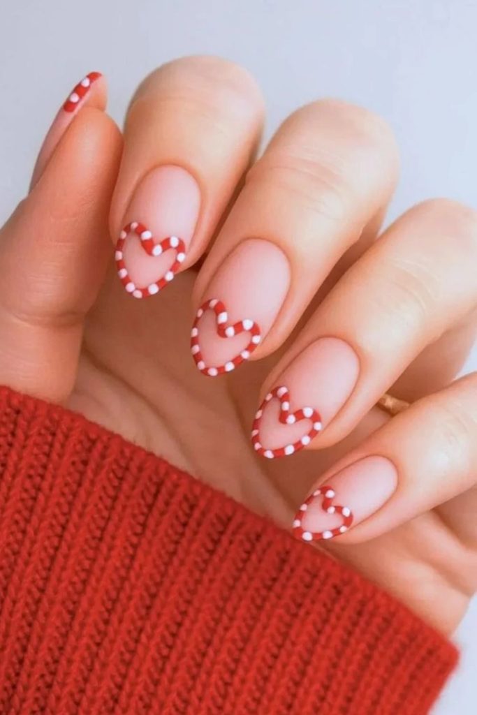 Romantic peppermint heart candy cane nails.