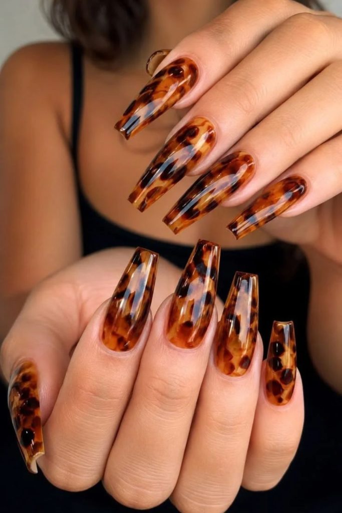 Long coffin tortoiseshell statement nails.