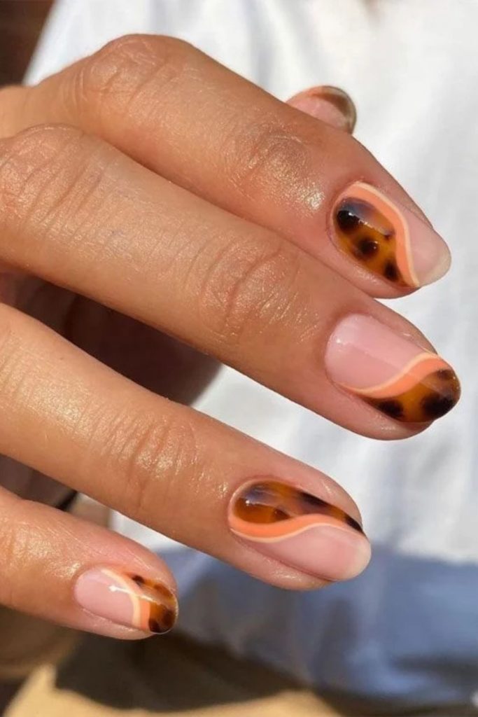 Negative space tortoiseshell minimalist nails.