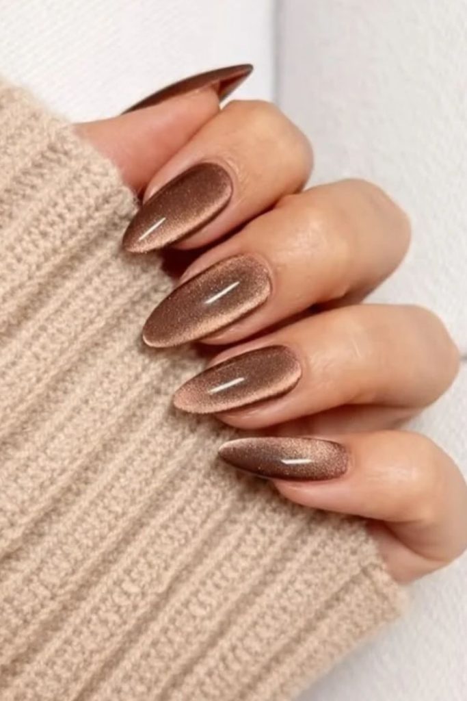 Velvety brown nails with creamy accents.