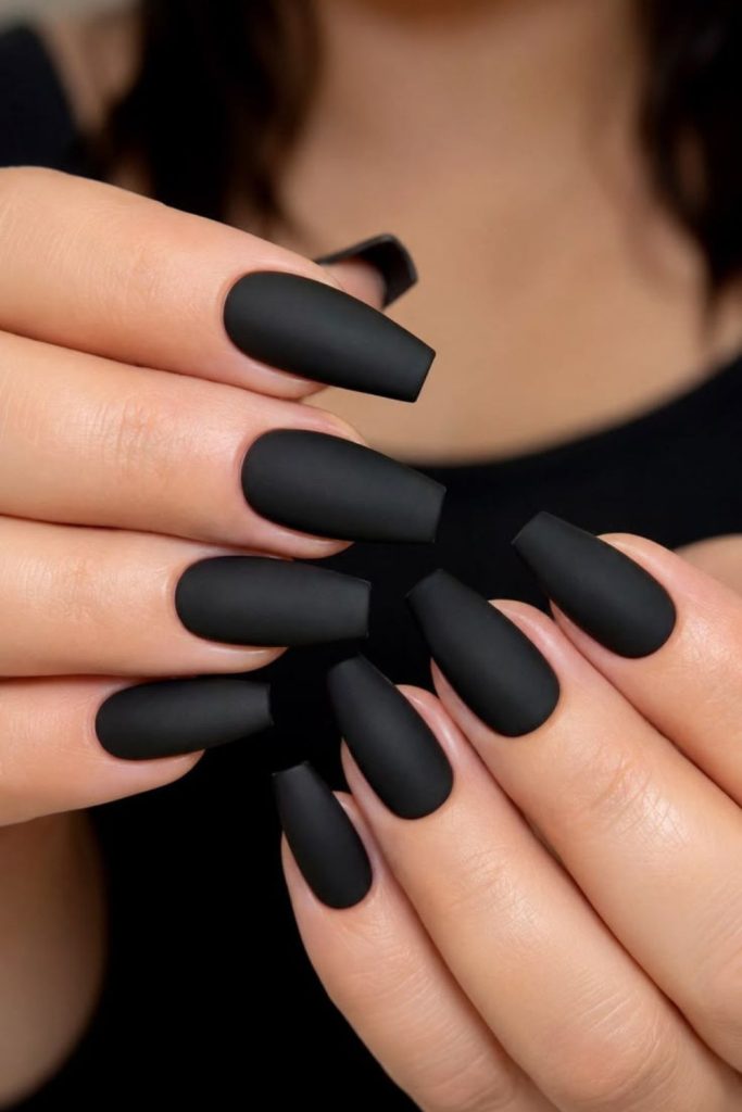 Velvet black coffin nails with shimmer.