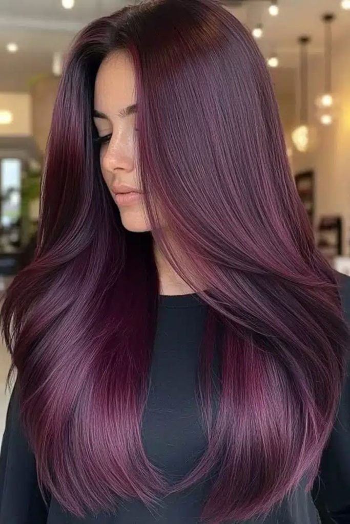 Velvet plum cascading long layered hair.