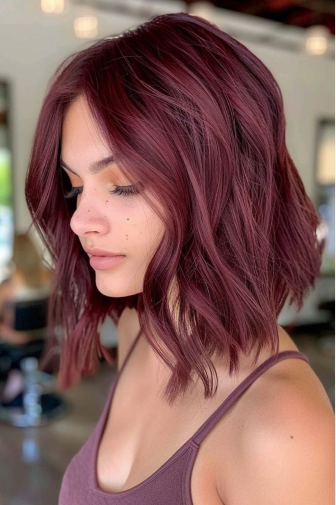 Rosewood velvet hair with subtle warmth.