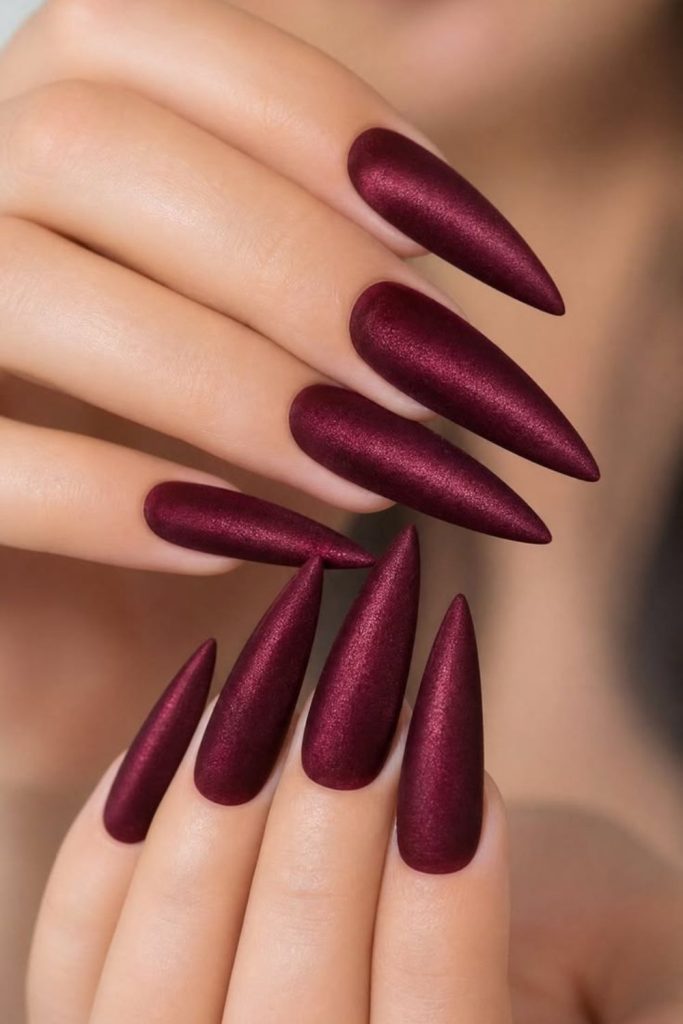 Deep wine velvet stiletto nails.