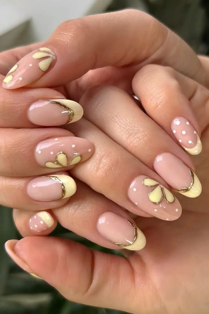Butter yellow floral French manicure.