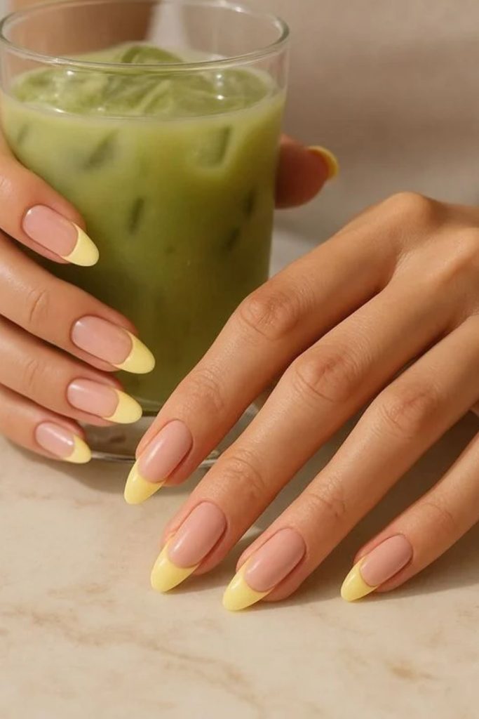 Butter yellow luxury French tip nails.