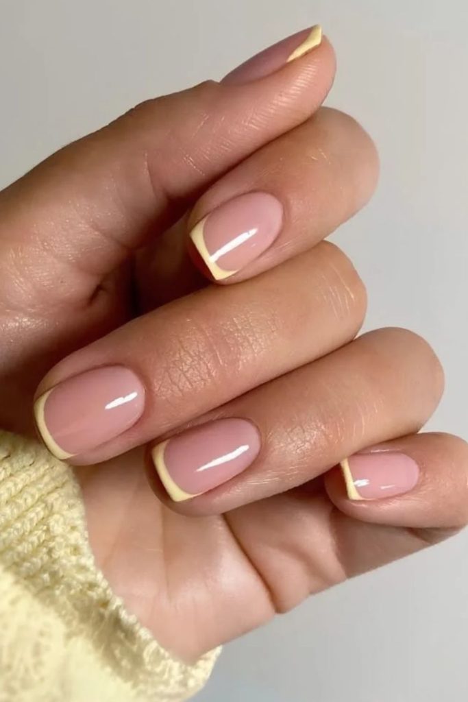 Butter yellow micro French nails.