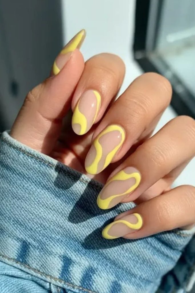 Butter yellow negative space nails.