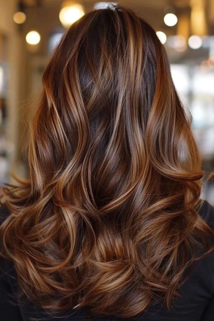 Espresso brown hair with butterscotch ribbons.