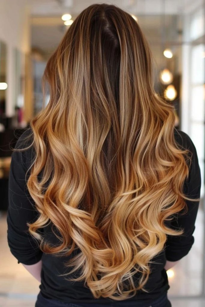Dark roots with butterscotch blonde lengths.