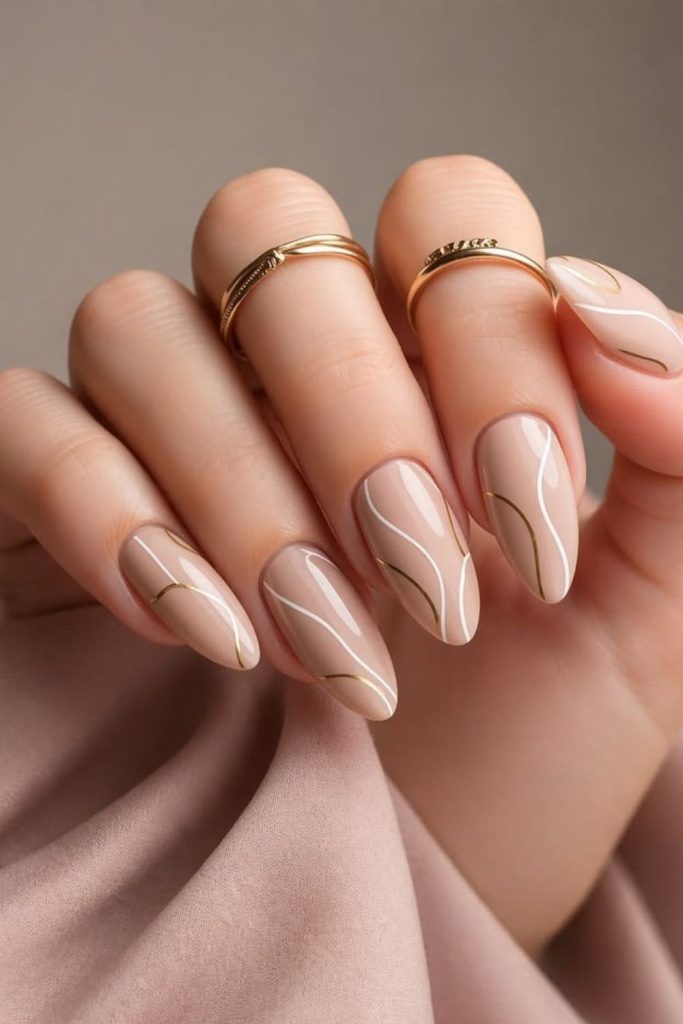 Champagne Abstract Line Nails with Artistic Curves.