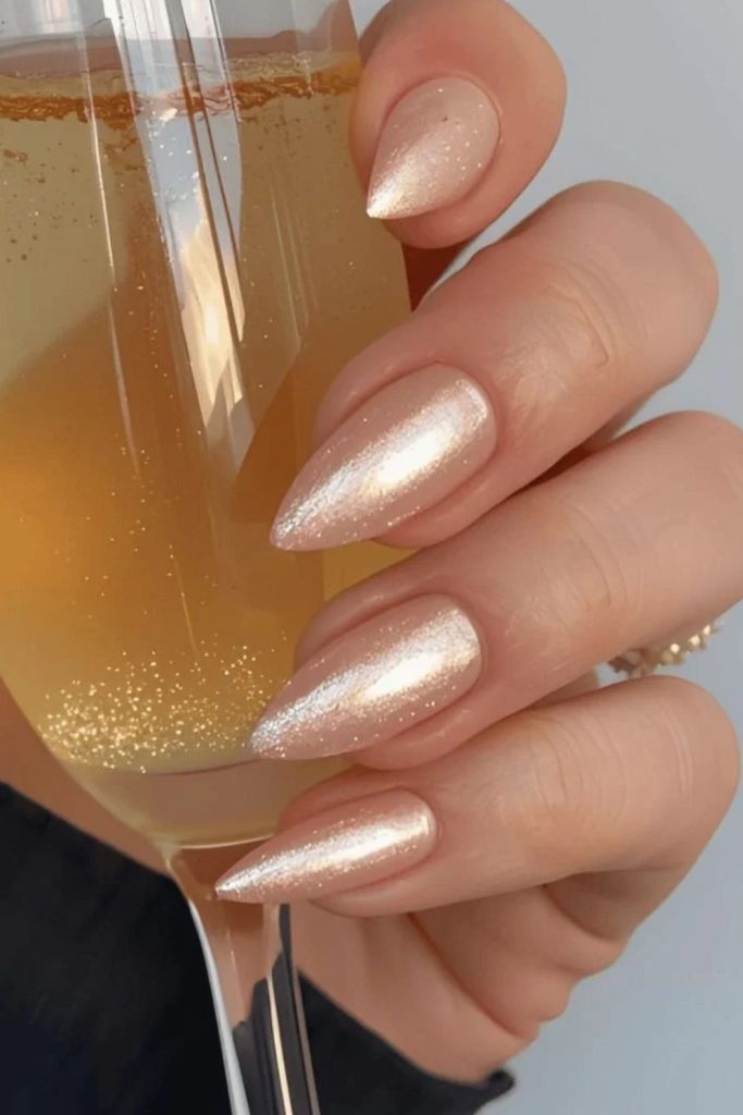 Champagne Glitter Accent Nails with Golden Sparkle.