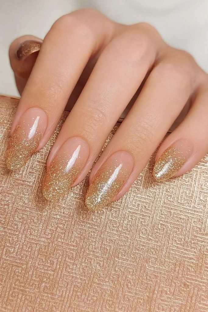 Champagne Ombre Chrome Nails with Metallic Glow.