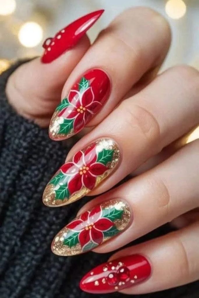 Champagne shimmer nails with delicate poinsettia artwork.